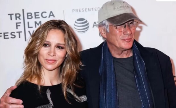 "Dad, Mom and Alexander".  Handsome Richard Gere walking with his charming wife and son captured on a stylish photo