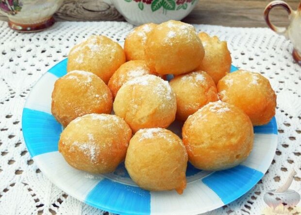 Italian salted donuts according to the recipe from Lombardy. A mountain of golden donuts for insatiable relatives